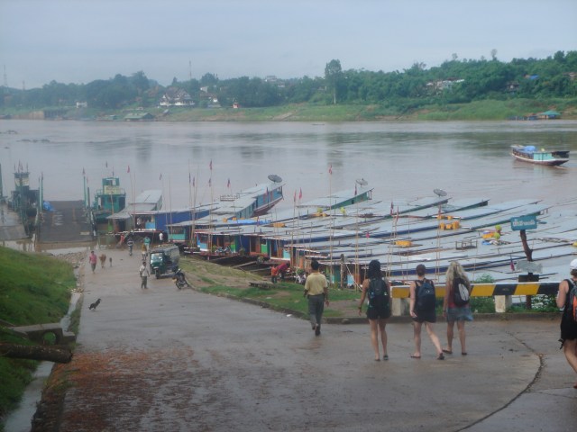 Gingerly heading to the slow boats with our local guide, Somdy