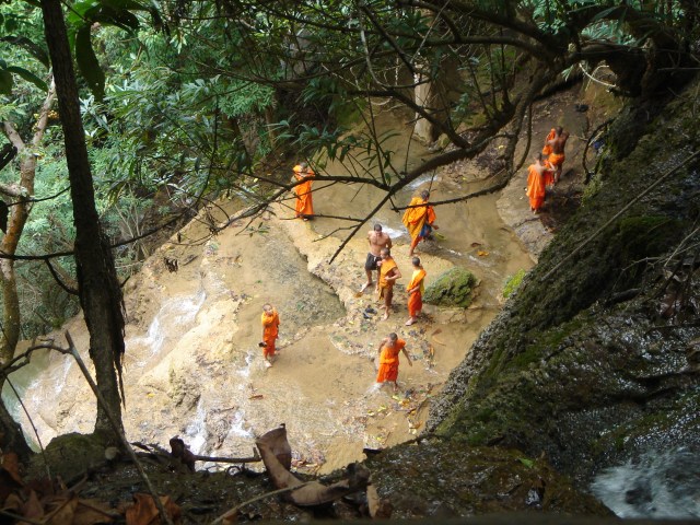 Monks on their ledge below