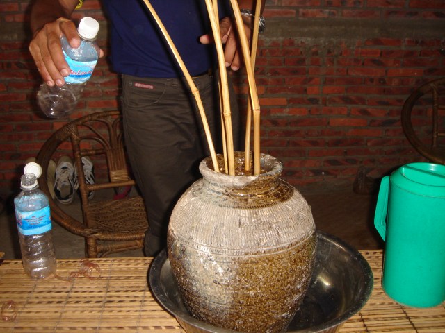 Rice wine with bamboo straws