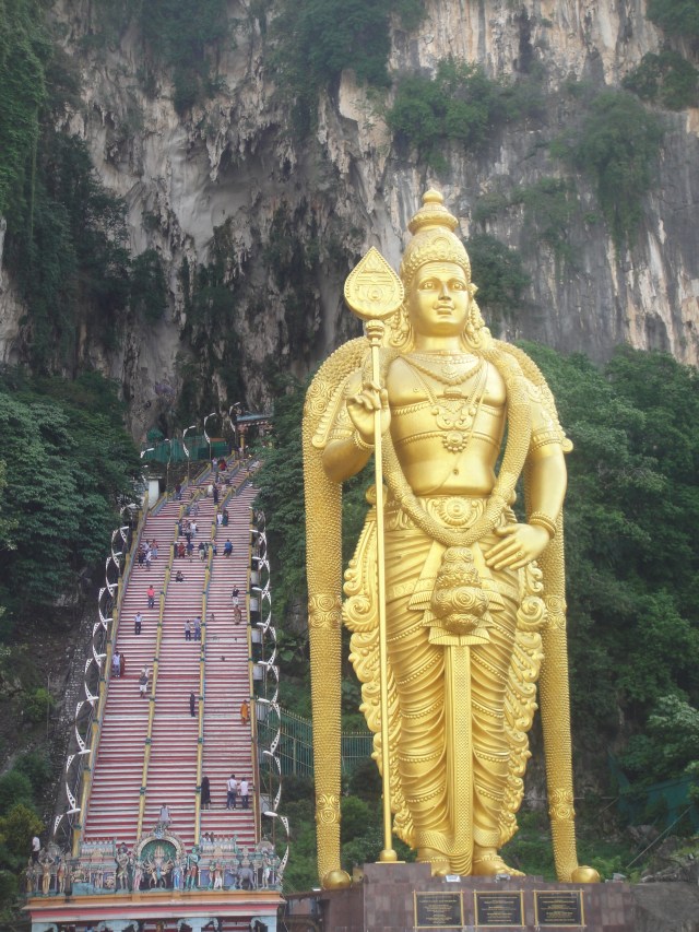 Stairway to the Batu Caves beside the statue of Murugan