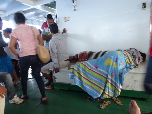 A pair of pregnant local women find a comfortable perch for the trip to Atauro Island