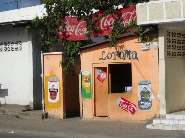 A Dili storefront with some charming, self made advertising signage