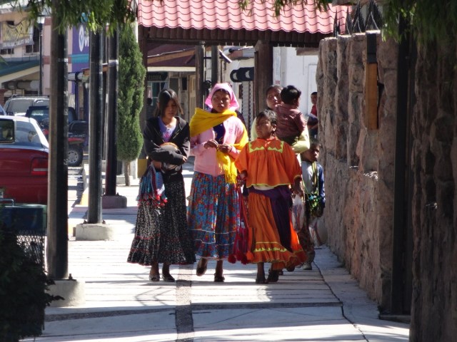 A small family in colourful garb