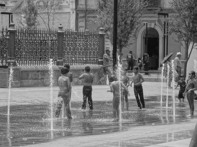Local kids cooling off in front of the cathedral