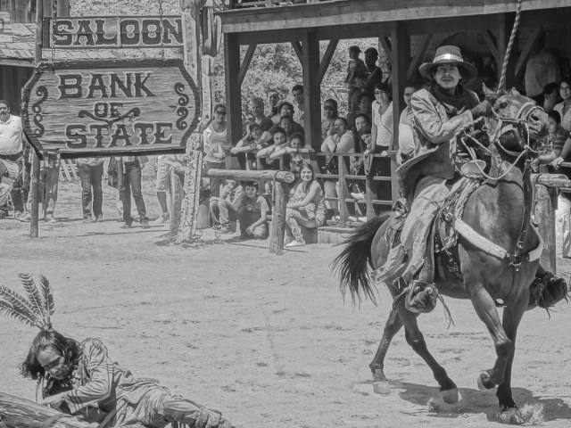 One of the outlaws dealing with an Indian