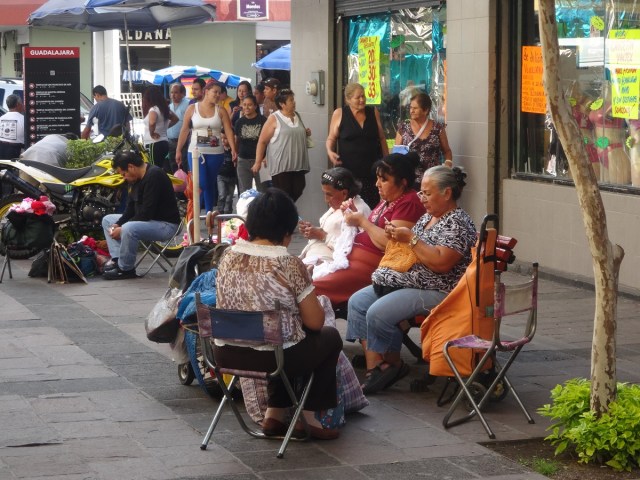 In a mall, a troupe of knitting nannas