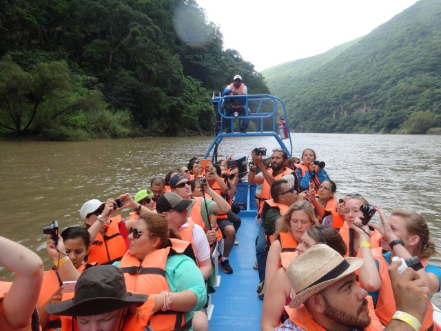 Our crowded boat, complete with guide perched above the stern