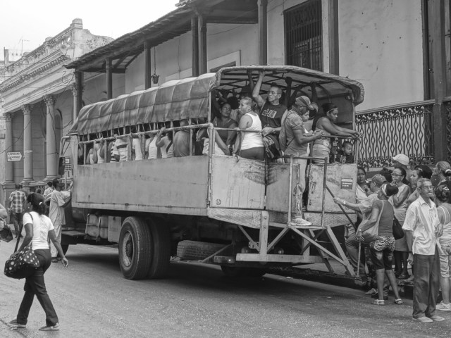 Gritty, working class Santiago. This is public busing, Cuban style