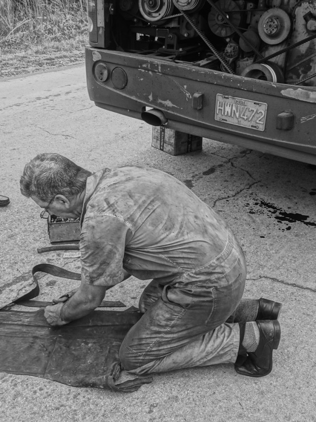 Fashioning a makeshift oil hose with some bits of rubber