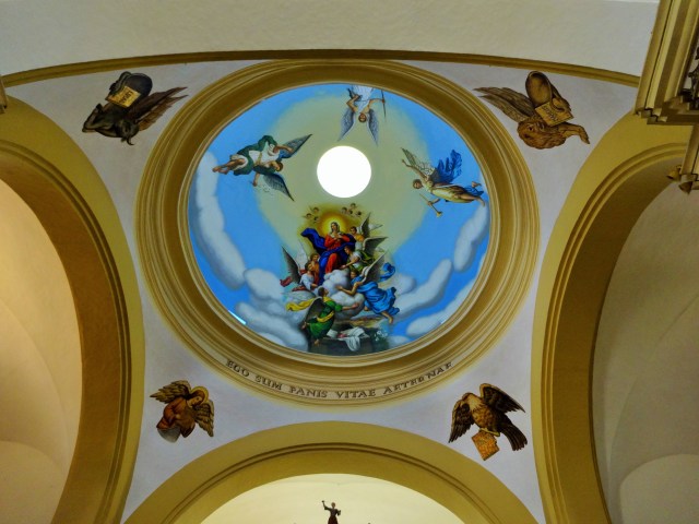 A perhaps even more impressive painted ceiling lies within