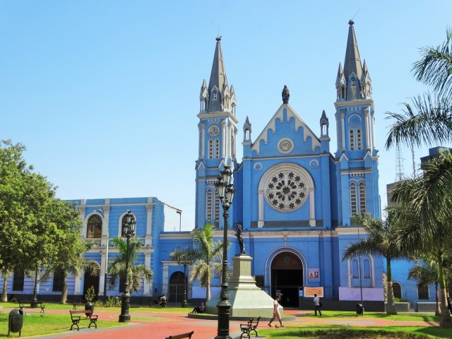 A blue church under blue skies