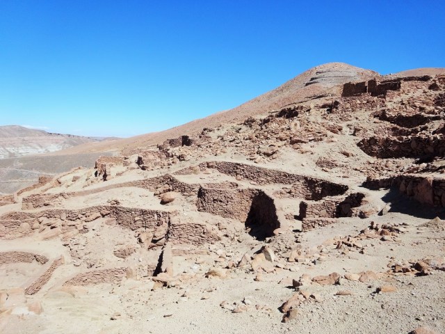 Looking back over the Pukara de Quitor ruins, with the hill and mirador visible behind