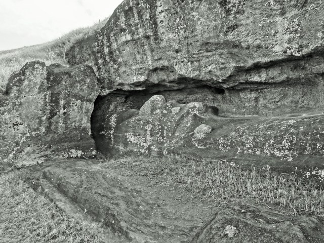 An incomplete Moai, still a part of the rock from which it was carved