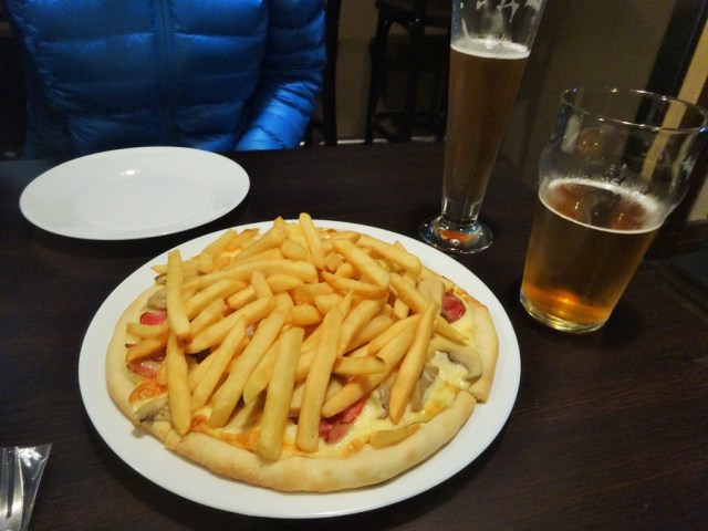Our cheese, mushroom and bacon pizza, complete with french fries!