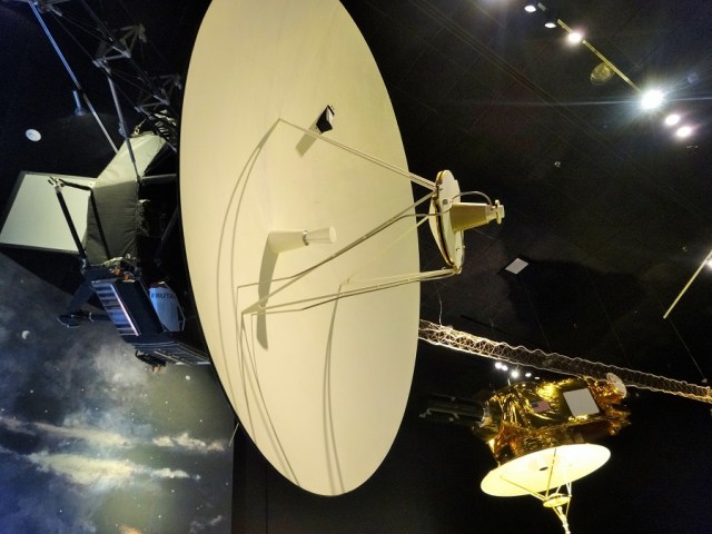 Scale models of the Voyager spacecraft and the more recent, New Horizons