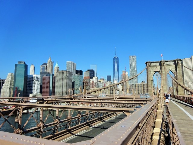 Waltzing across the Brooklyn Bridge, doing in minutes what it took ?? to build