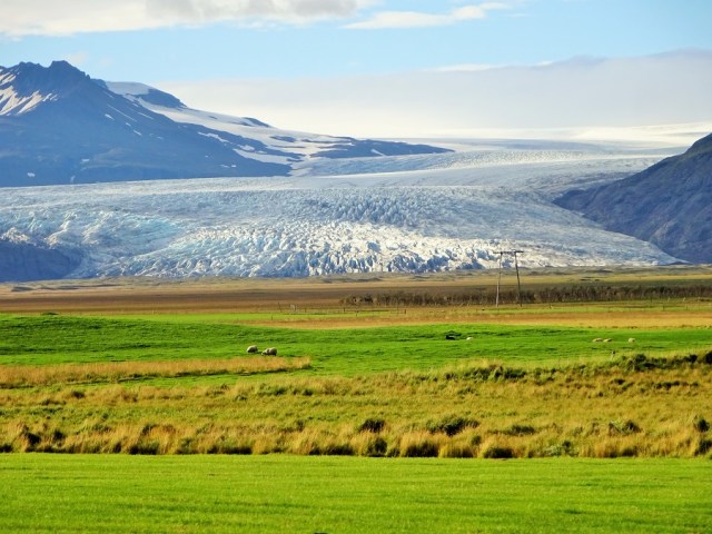 Passing a section of the Vatnajökull glacier which seemingly spews forth into a farmers fields!